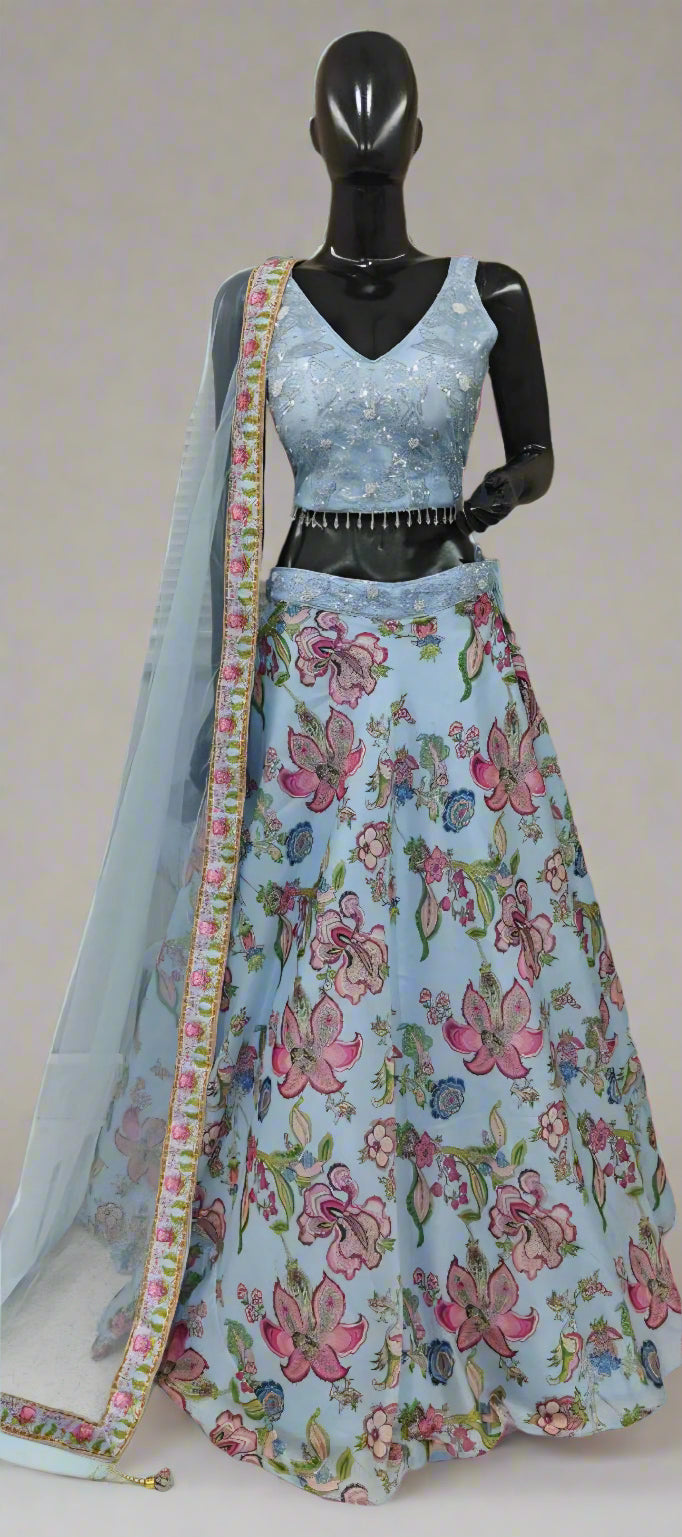Light blue floral lehenga with matching blouse on a mannequin against a neutral background