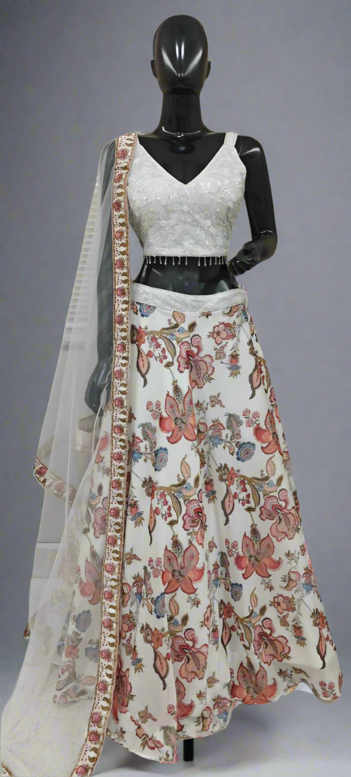 Mannequin wearing a floral dress with a sheer dupatta against a neutral background